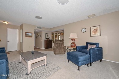 This charming 2 bedroom, 2 bath home has a bright living room on Sun City Lakes West and East in Arizona - for sale on GolfHomes.com, golf home, golf lot