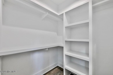 Discover a home that flawlessly blends modern sophistication on Carolina Shores Golf Course in North Carolina - for sale on GolfHomes.com, golf home, golf lot