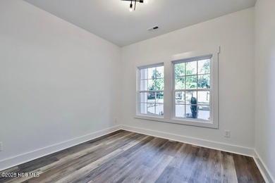 Discover a home that flawlessly blends modern sophistication on Carolina Shores Golf Course in North Carolina - for sale on GolfHomes.com, golf home, golf lot