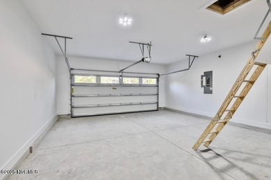 Discover a home that flawlessly blends modern sophistication on Carolina Shores Golf Course in North Carolina - for sale on GolfHomes.com, golf home, golf lot