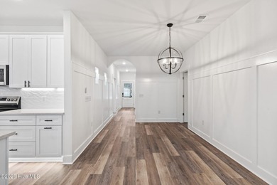 Discover a home that flawlessly blends modern sophistication on Carolina Shores Golf Course in North Carolina - for sale on GolfHomes.com, golf home, golf lot