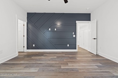 Discover a home that flawlessly blends modern sophistication on Carolina Shores Golf Course in North Carolina - for sale on GolfHomes.com, golf home, golf lot