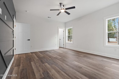 Discover a home that flawlessly blends modern sophistication on Carolina Shores Golf Course in North Carolina - for sale on GolfHomes.com, golf home, golf lot