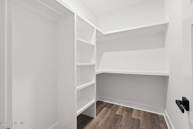 Discover a home that flawlessly blends modern sophistication on Carolina Shores Golf Course in North Carolina - for sale on GolfHomes.com, golf home, golf lot