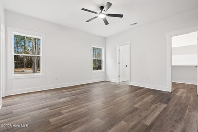 Discover a home that flawlessly blends modern sophistication on Carolina Shores Golf Course in North Carolina - for sale on GolfHomes.com, golf home, golf lot