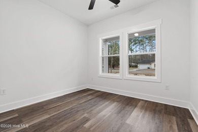 Discover a home that flawlessly blends modern sophistication on Carolina Shores Golf Course in North Carolina - for sale on GolfHomes.com, golf home, golf lot