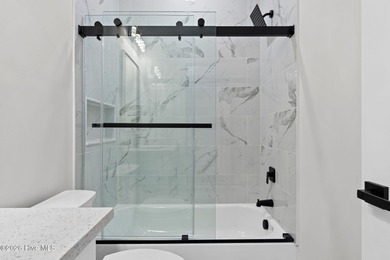 Discover a home that flawlessly blends modern sophistication on Carolina Shores Golf Course in North Carolina - for sale on GolfHomes.com, golf home, golf lot