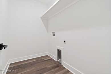 Discover a home that flawlessly blends modern sophistication on Carolina Shores Golf Course in North Carolina - for sale on GolfHomes.com, golf home, golf lot