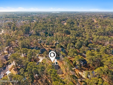 Discover a home that flawlessly blends modern sophistication on Carolina Shores Golf Course in North Carolina - for sale on GolfHomes.com, golf home, golf lot