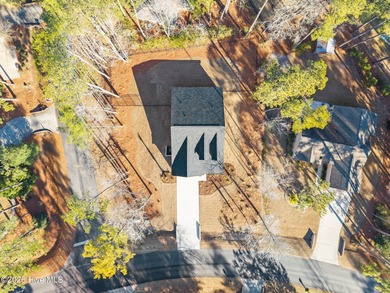 Discover a home that flawlessly blends modern sophistication on Carolina Shores Golf Course in North Carolina - for sale on GolfHomes.com, golf home, golf lot