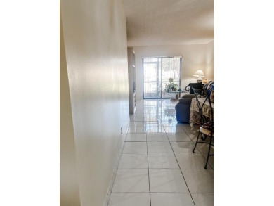 Discover this charming and conveniently located first-floor on Sunrise Lakes Phase IV Golf Course in Florida - for sale on GolfHomes.com, golf home, golf lot