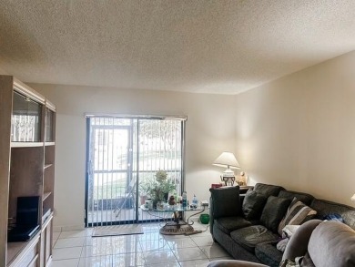 Discover this charming and conveniently located first-floor on Sunrise Lakes Phase IV Golf Course in Florida - for sale on GolfHomes.com, golf home, golf lot
