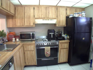 Discover this charming and conveniently located first-floor on Sunrise Lakes Phase IV Golf Course in Florida - for sale on GolfHomes.com, golf home, golf lot