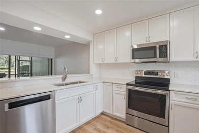 Located in the Fairway Lakes neighborhood of Carrollwood Village on Carrollwood Country Club in Florida - for sale on GolfHomes.com, golf home, golf lot