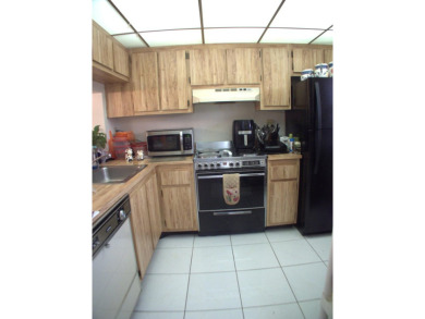 Discover this charming and conveniently located first-floor on Sunrise Lakes Phase IV Golf Course in Florida - for sale on GolfHomes.com, golf home, golf lot