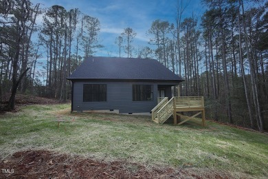 Beautifully custom designed ranch style home with 3 bedrooms on on River Golf and County Club at Lake Royale in North Carolina - for sale on GolfHomes.com, golf home, golf lot