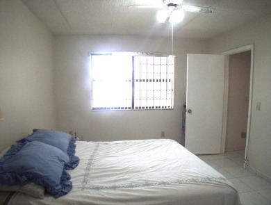 Discover this charming and conveniently located first-floor on Sunrise Lakes Phase IV Golf Course in Florida - for sale on GolfHomes.com, golf home, golf lot