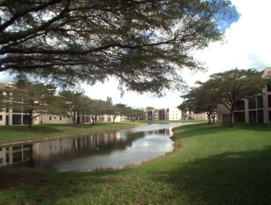 Discover this charming and conveniently located first-floor on Sunrise Lakes Phase IV Golf Course in Florida - for sale on GolfHomes.com, golf home, golf lot