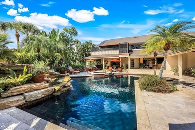 Set across two private, meticulously landscaped lots inside the on Fiddlesticks Country Club in Florida - for sale on GolfHomes.com, golf home, golf lot