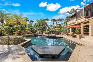 Set across two private, meticulously landscaped lots inside the on Fiddlesticks Country Club in Florida - for sale on GolfHomes.com, golf home, golf lot