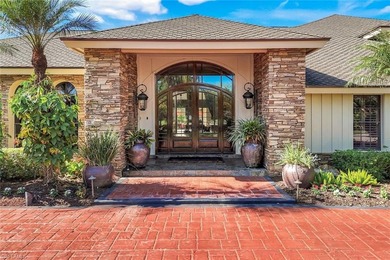 Set across two private, meticulously landscaped lots inside the on Fiddlesticks Country Club in Florida - for sale on GolfHomes.com, golf home, golf lot