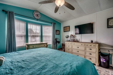 Situated on an oversized lot, this clean, bright, and move-in on Barefoot Resort and Golf Club  in South Carolina - for sale on GolfHomes.com, golf home, golf lot