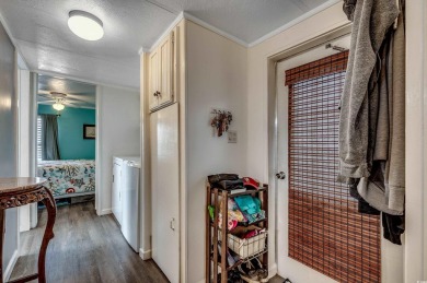 Situated on an oversized lot, this clean, bright, and move-in on Barefoot Resort and Golf Club  in South Carolina - for sale on GolfHomes.com, golf home, golf lot