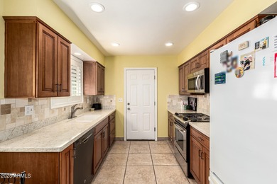 Huge lot. Swimming pool. Beautifully landscaped with grass. This on Sun City Country Club in Arizona - for sale on GolfHomes.com, golf home, golf lot