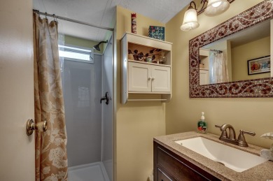 Situated on an oversized lot, this clean, bright, and move-in on Barefoot Resort and Golf Club  in South Carolina - for sale on GolfHomes.com, golf home, golf lot