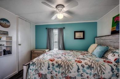 Situated on an oversized lot, this clean, bright, and move-in on Barefoot Resort and Golf Club  in South Carolina - for sale on GolfHomes.com, golf home, golf lot