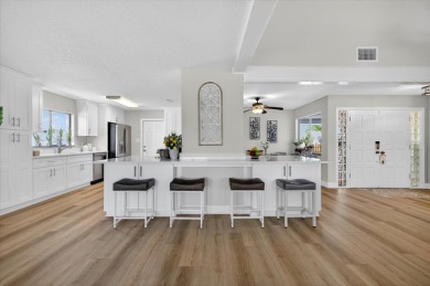 Picture yourself in a tropical oasis, where lush landscapes and on Gulf Harbors Golf Course in Florida - for sale on GolfHomes.com, golf home, golf lot