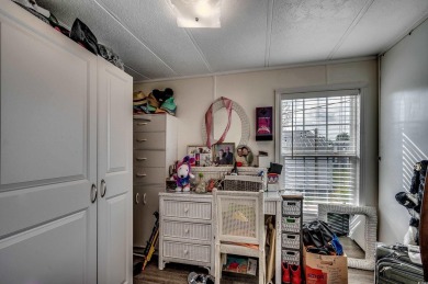 Situated on an oversized lot, this clean, bright, and move-in on Barefoot Resort and Golf Club  in South Carolina - for sale on GolfHomes.com, golf home, golf lot