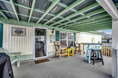 Situated on an oversized lot, this clean, bright, and move-in on Barefoot Resort and Golf Club  in South Carolina - for sale on GolfHomes.com, golf home, golf lot