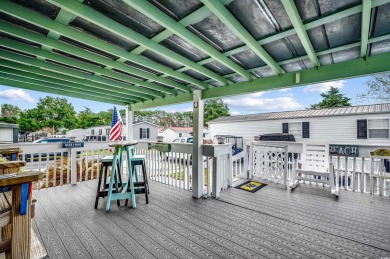 Situated on an oversized lot, this clean, bright, and move-in on Barefoot Resort and Golf Club  in South Carolina - for sale on GolfHomes.com, golf home, golf lot