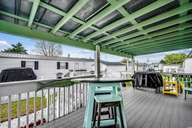 Situated on an oversized lot, this clean, bright, and move-in on Barefoot Resort and Golf Club  in South Carolina - for sale on GolfHomes.com, golf home, golf lot