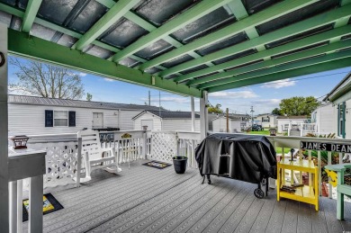 Situated on an oversized lot, this clean, bright, and move-in on Barefoot Resort and Golf Club  in South Carolina - for sale on GolfHomes.com, golf home, golf lot
