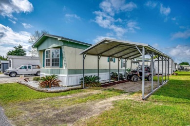Situated on an oversized lot, this clean, bright, and move-in on Barefoot Resort and Golf Club  in South Carolina - for sale on GolfHomes.com, golf home, golf lot