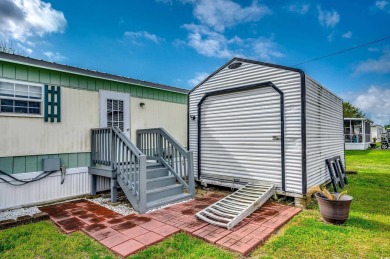 Situated on an oversized lot, this clean, bright, and move-in on Barefoot Resort and Golf Club  in South Carolina - for sale on GolfHomes.com, golf home, golf lot