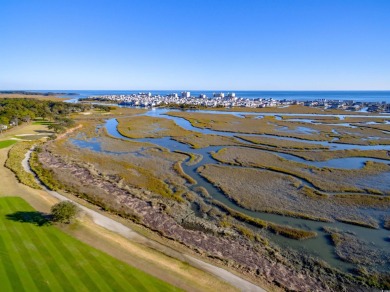 Situated on an oversized lot, this clean, bright, and move-in on Barefoot Resort and Golf Club  in South Carolina - for sale on GolfHomes.com, golf home, golf lot