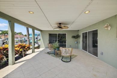 Picture yourself in a tropical oasis, where lush landscapes and on Gulf Harbors Golf Course in Florida - for sale on GolfHomes.com, golf home, golf lot