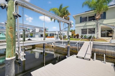 Picture yourself in a tropical oasis, where lush landscapes and on Gulf Harbors Golf Course in Florida - for sale on GolfHomes.com, golf home, golf lot