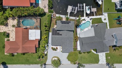 Picture yourself in a tropical oasis, where lush landscapes and on Gulf Harbors Golf Course in Florida - for sale on GolfHomes.com, golf home, golf lot