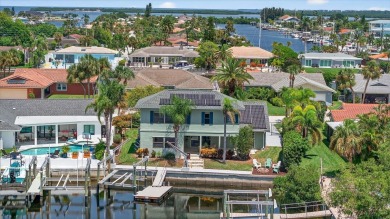 Picture yourself in a tropical oasis, where lush landscapes and on Gulf Harbors Golf Course in Florida - for sale on GolfHomes.com, golf home, golf lot