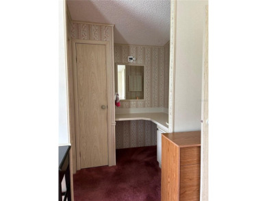Double wide mobile home with 2 bedrooms, 2 Baths and 1040 sq ft on Orange Blossom Hills Golf and Country Club in Florida - for sale on GolfHomes.com, golf home, golf lot