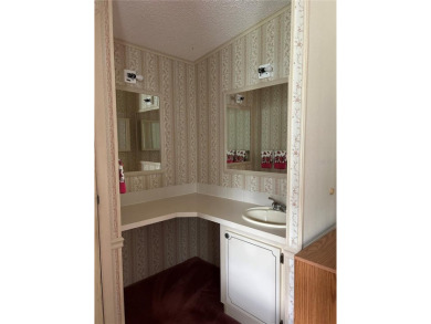 Double wide mobile home with 2 bedrooms, 2 Baths and 1040 sq ft on Orange Blossom Hills Golf and Country Club in Florida - for sale on GolfHomes.com, golf home, golf lot
