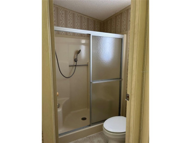 Double wide mobile home with 2 bedrooms, 2 Baths and 1040 sq ft on Orange Blossom Hills Golf and Country Club in Florida - for sale on GolfHomes.com, golf home, golf lot