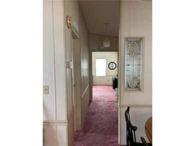 Double wide mobile home with 2 bedrooms, 2 Baths and 1040 sq ft on Orange Blossom Hills Golf and Country Club in Florida - for sale on GolfHomes.com, golf home, golf lot