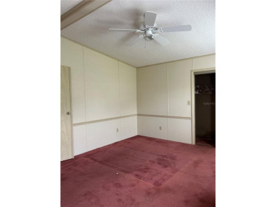 Double wide mobile home with 2 bedrooms, 2 Baths and 1040 sq ft on Orange Blossom Hills Golf and Country Club in Florida - for sale on GolfHomes.com, golf home, golf lot