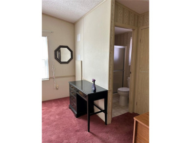 Double wide mobile home with 2 bedrooms, 2 Baths and 1040 sq ft on Orange Blossom Hills Golf and Country Club in Florida - for sale on GolfHomes.com, golf home, golf lot
