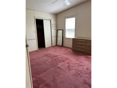Double wide mobile home with 2 bedrooms, 2 Baths and 1040 sq ft on Orange Blossom Hills Golf and Country Club in Florida - for sale on GolfHomes.com, golf home, golf lot